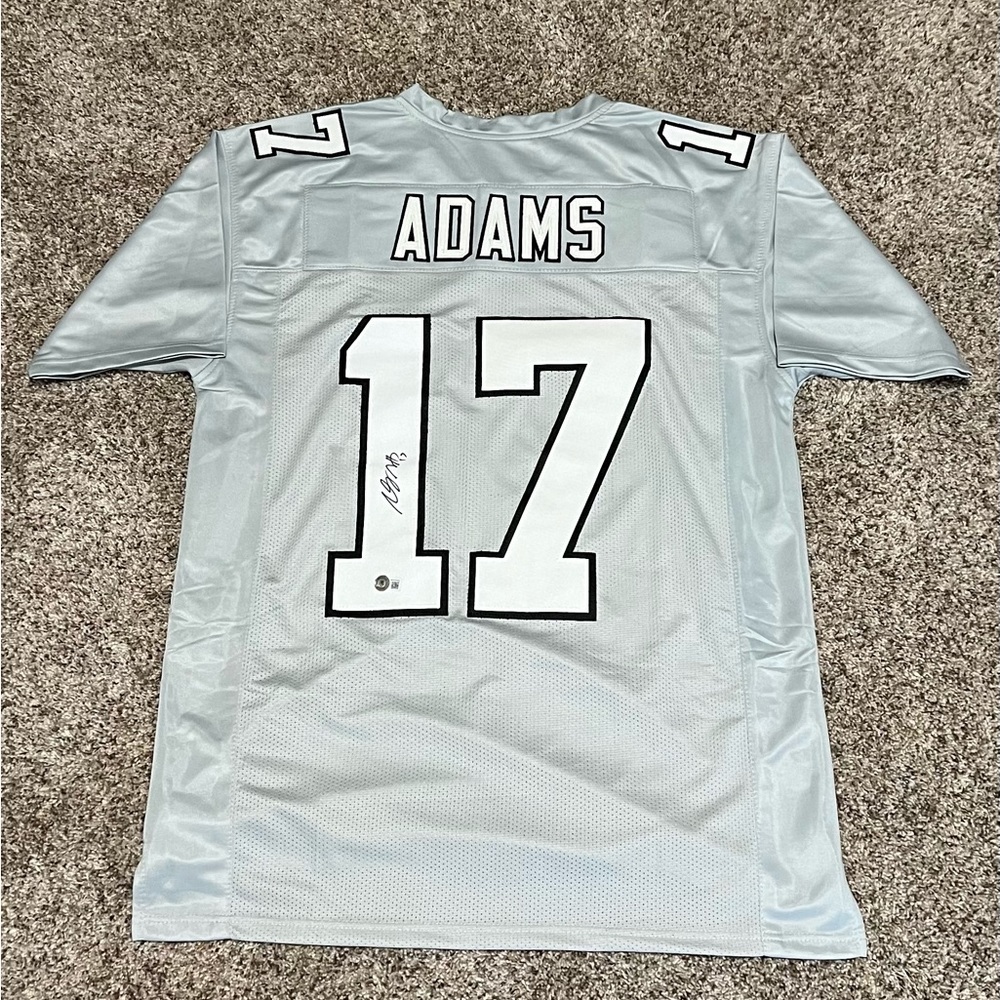 Devonte Adam’s autographed jersey beckett certified autograph